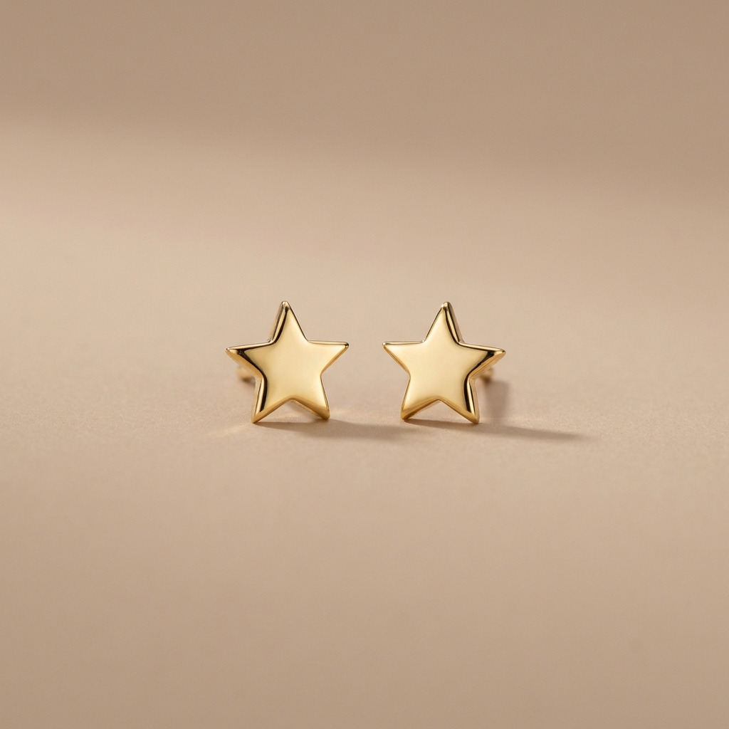 Gold star stud earrings on a neutral background — waterproof tarnish-free