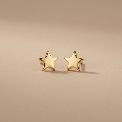 Gold star stud earrings on a neutral background — waterproof tarnish-free
