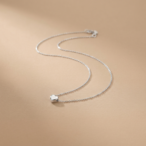 Silver heart pendant necklace on a neutral background — waterproof tarnish-free