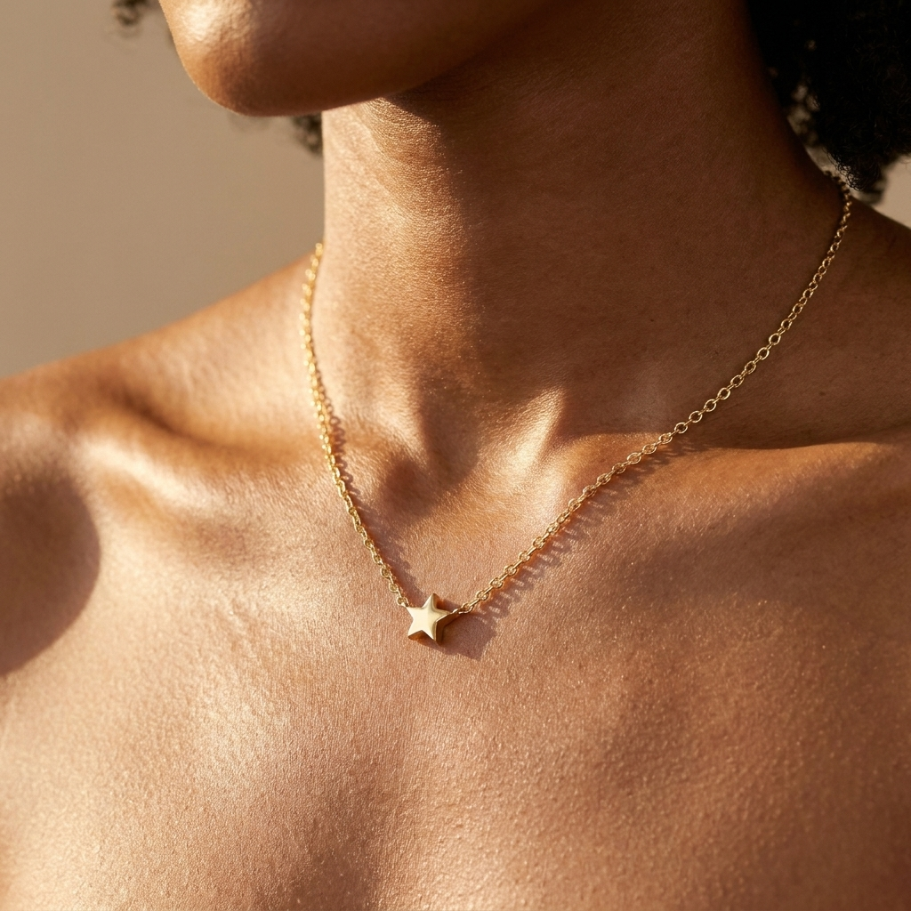Gold star pendant necklace worn close-up — waterproof by Pippa & Co
