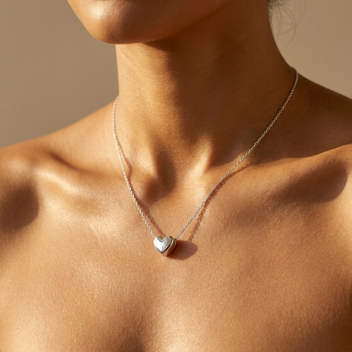 Silver heart pendant necklace worn close-up — waterproof by Pippa & Co