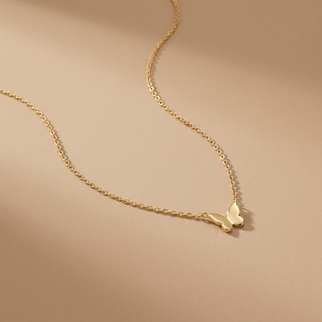 Gold butterfly pendant necklace on a neutral background — waterproof tarnish-free