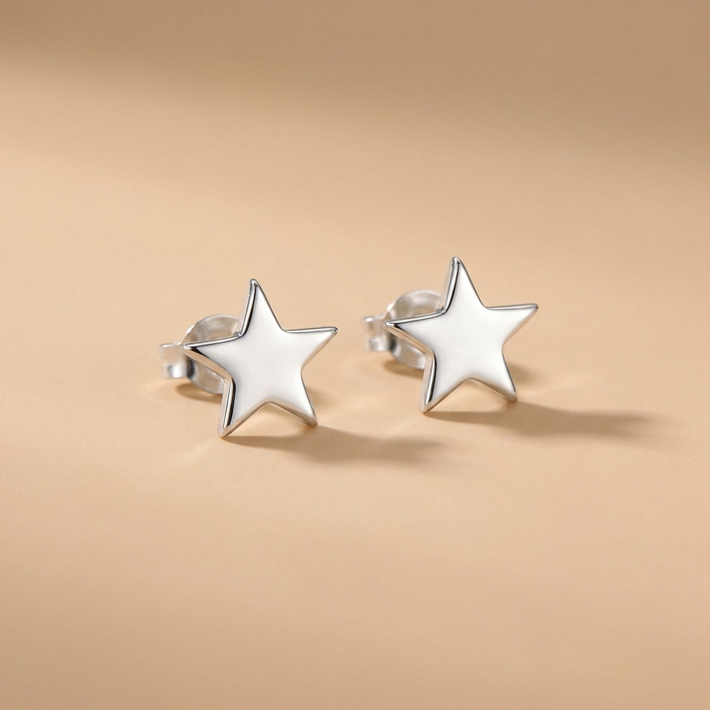 Silver star stud earrings on a neutral background — waterproof tarnish-free