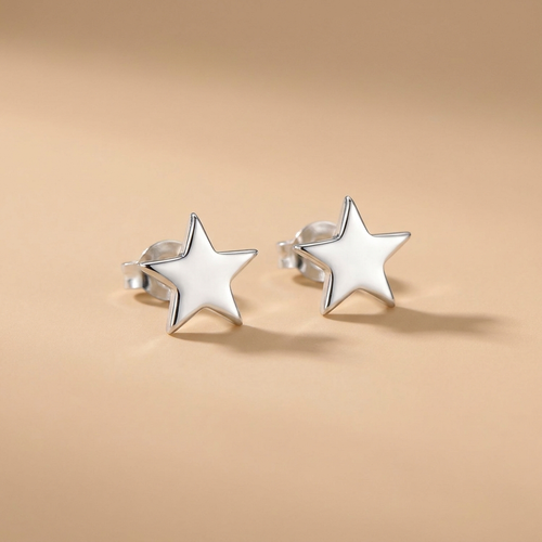 Silver star stud earrings on a neutral background — waterproof tarnish-free