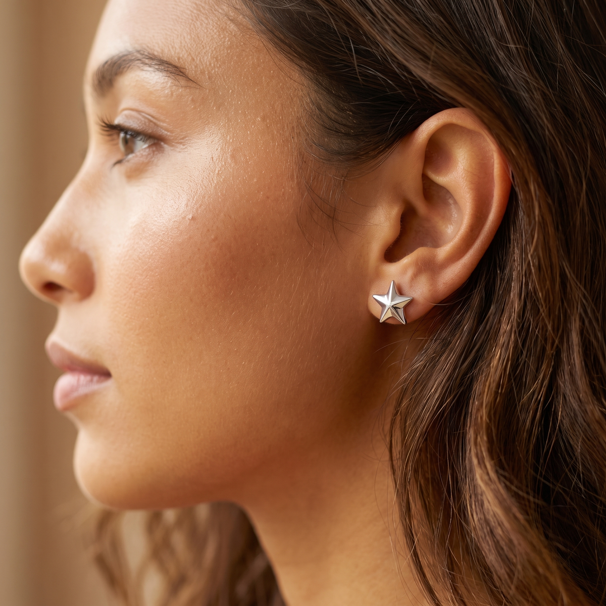 Silver Star Stud Earrings worn close-up