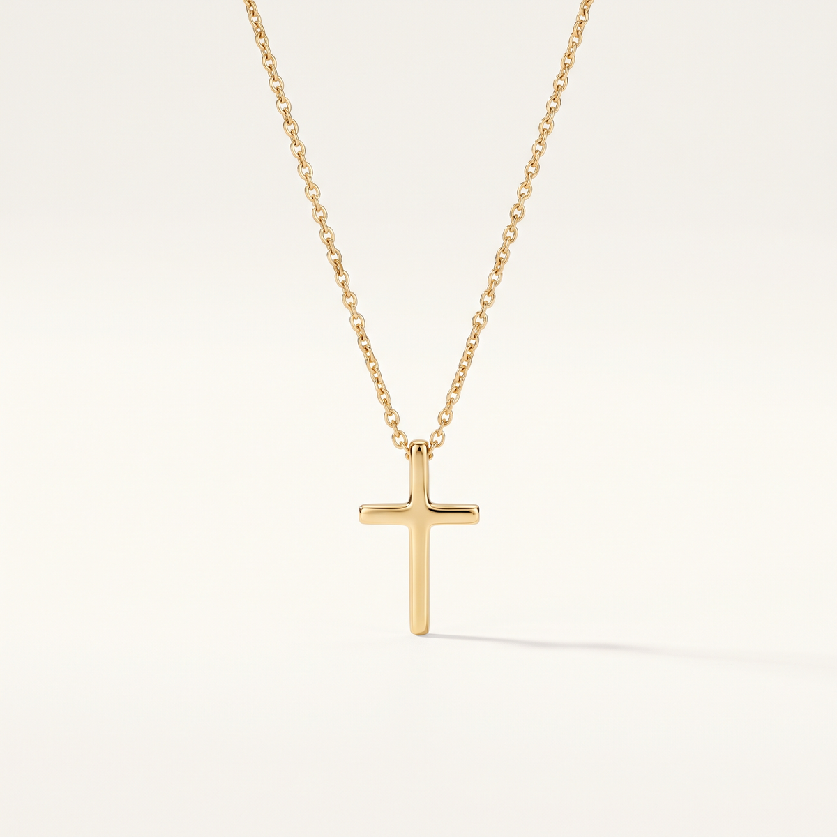 Gold Cross Pendant Necklace worn close-up
