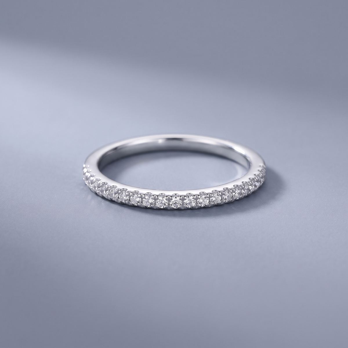 Silver CZ band ring worn close-up