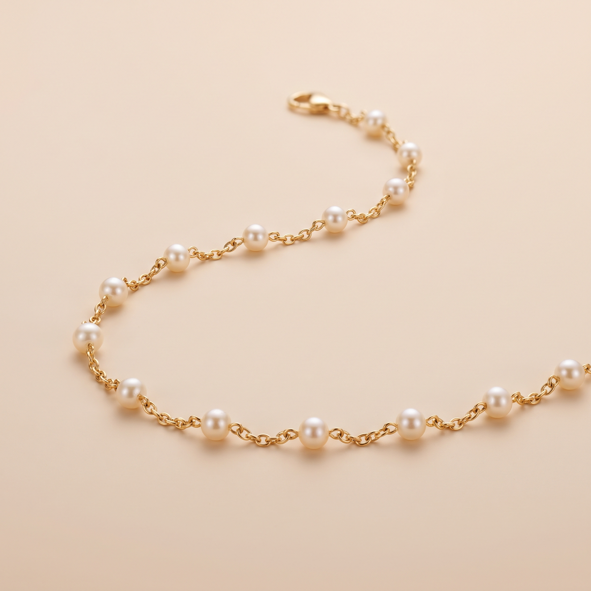 Gold pearl bracelet worn close-up